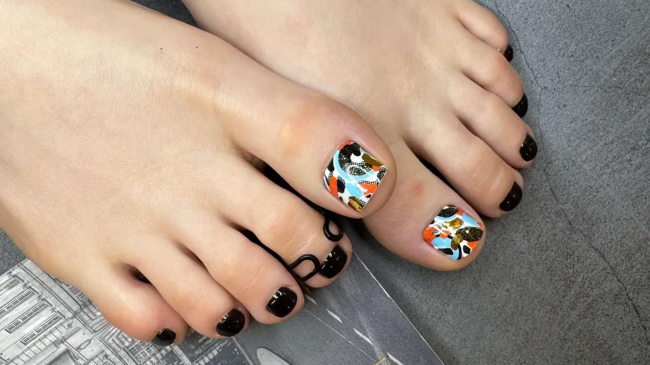 Nail technician working on a client’s toenails.