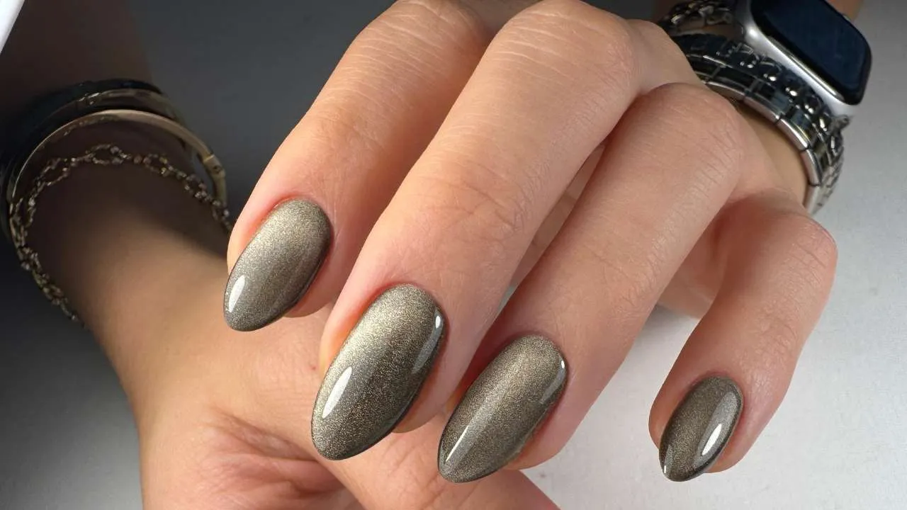 Close-up of metallic gray gel nails.