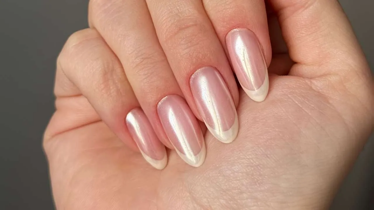 Pink and purple gel nails in an almond shape.